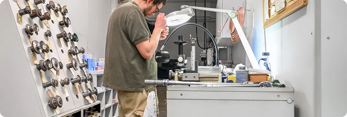 Technician inspecting precision cutting tools